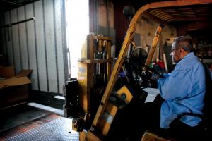 Pastor Wayne Gifford, founder of Abundance of Rain Ministries, unloads a shipment from Operation Sharing