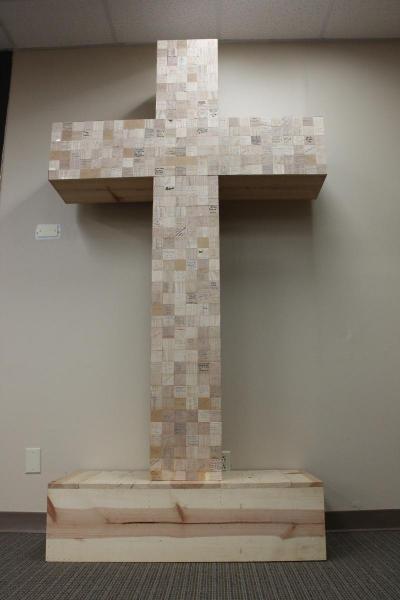 The cross was built by individual wood chips sent in by donors