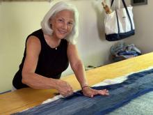 Vallorie Henderson creating fiber art in her home studio