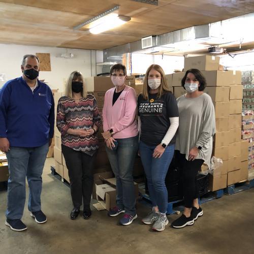 Insurance Agency and Carrier Make Donation, Volunteer at Grateful Bread Food Pantry