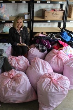 Hannah Amburgey stands with her donations