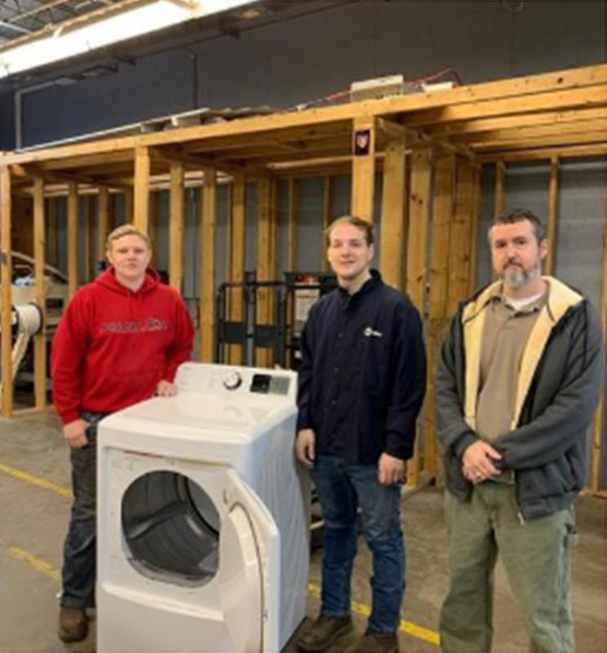 Floyd CArea Technology Center students receive gas dryers from Operation Sharing. 