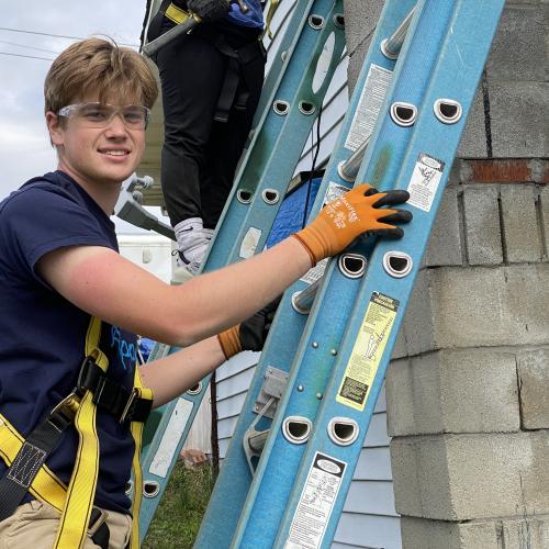 Stephen Butler, University of Scranton student, works on a home repair project during WorkFest.