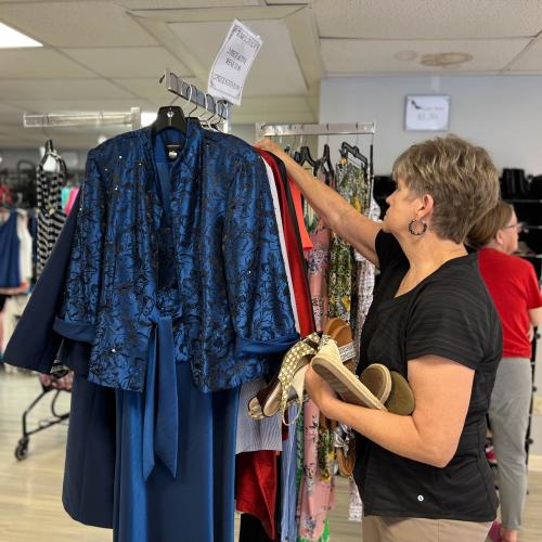 Laverne Winstead hanging clothes at Grateful Threadz