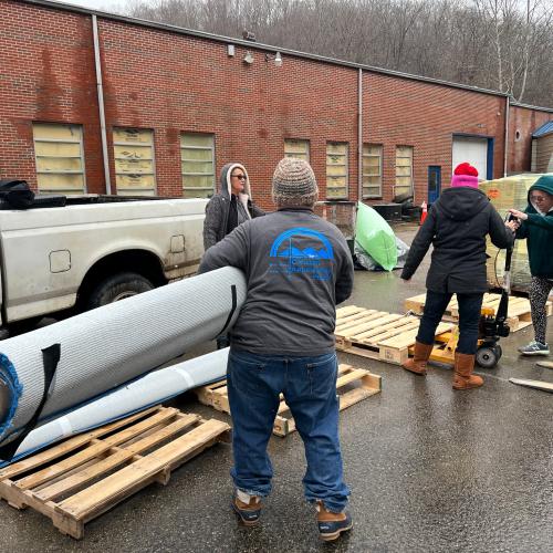 Rupp Arena partners with CAP to supply carpet to flood victims in need.