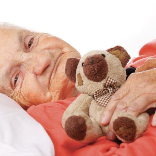 Senior laying down