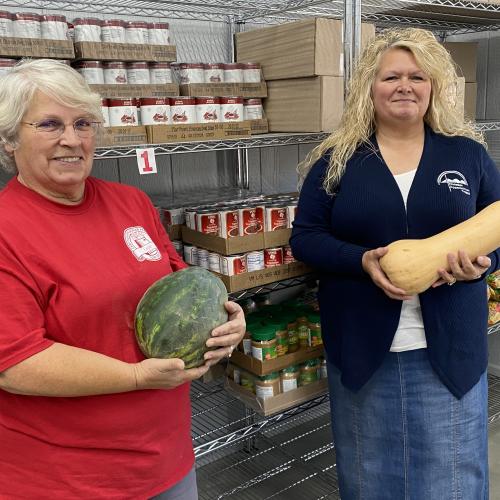 Eagle pantry staff with fresh produce