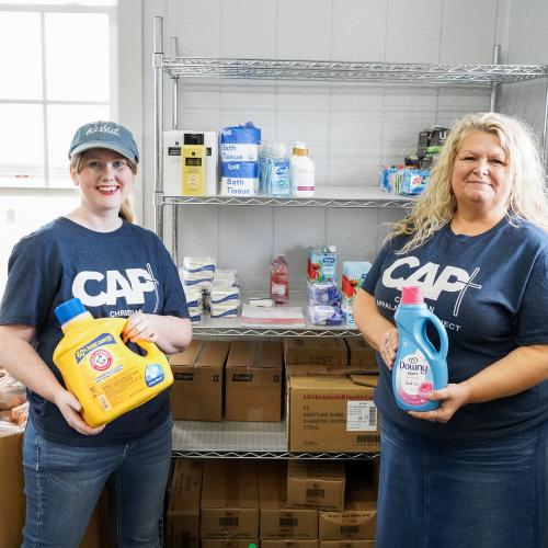 Eagle Pantry staff with hygiene shelf